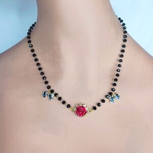 Red Rose with Black Bows on a Black Beaded Chain Necklace.